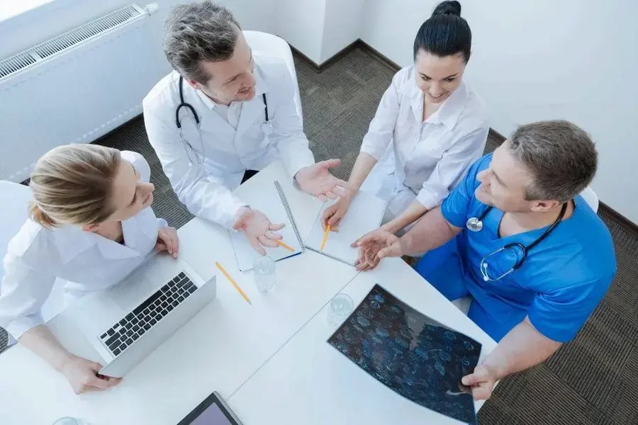 Healthcare professionals reviewing scans together