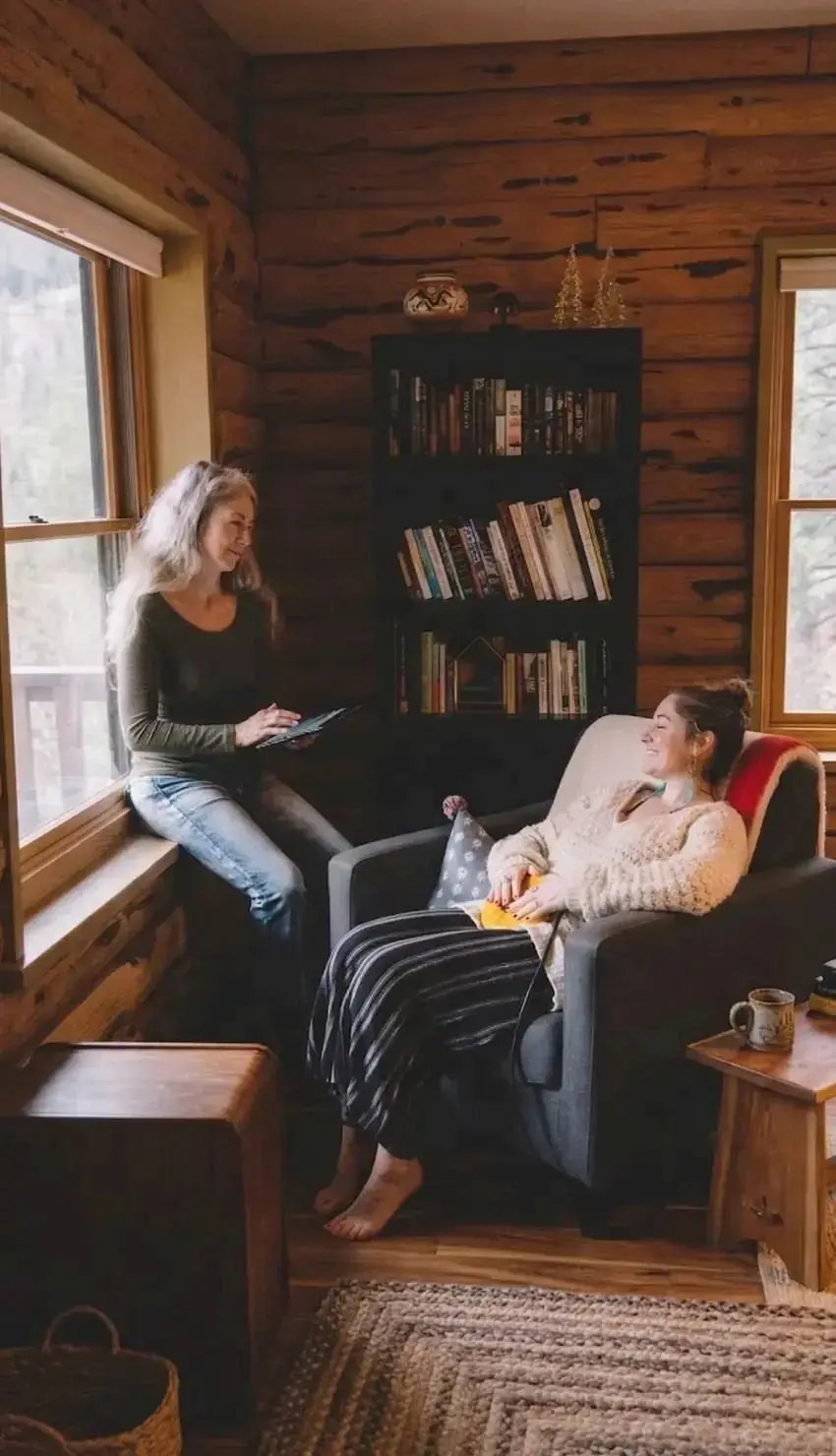 Practitioner and client in a cabin during an AmpCoil session
