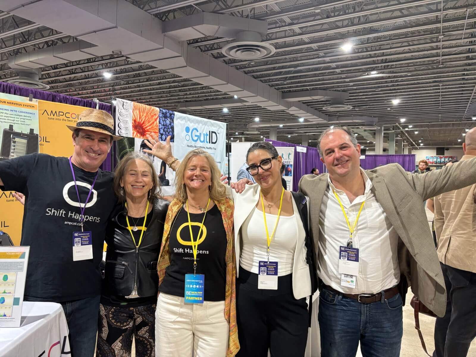 AmpCoil team with attendees at a biohacking expo