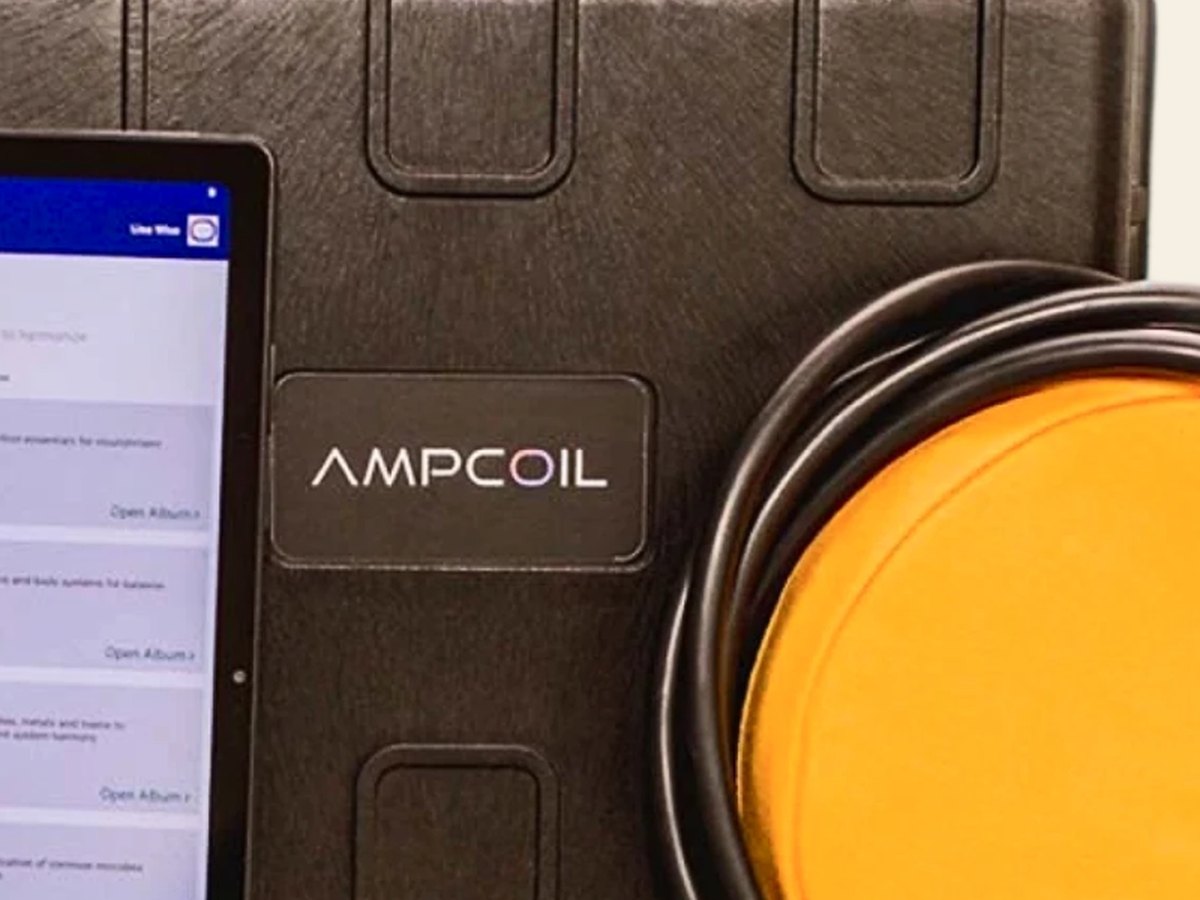 The AmpCoil amplifier, built into a hard shell carry case with the AMPCOIL label